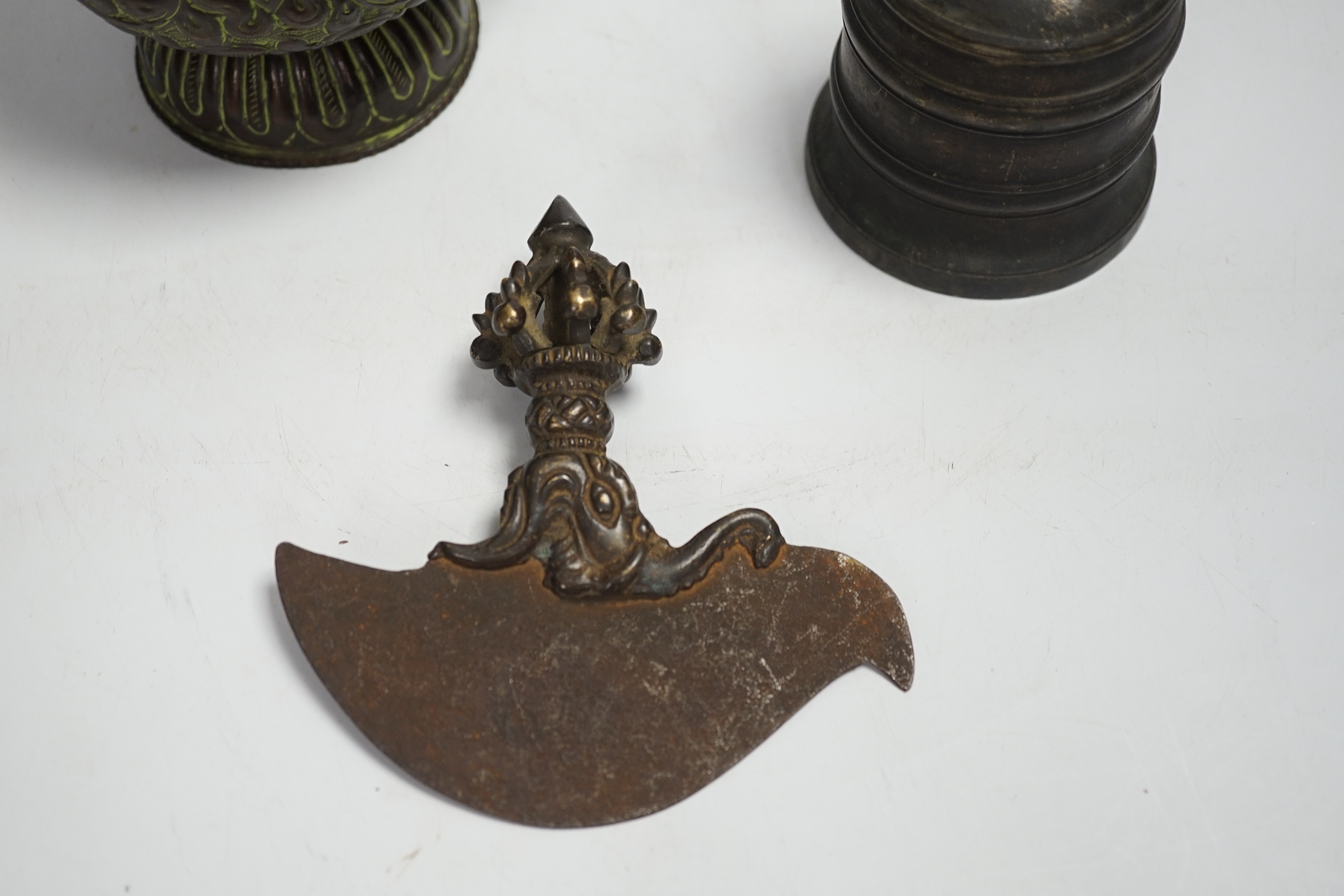 A Tibetan repousse teapot, a ghanta bell and a kartika chopper, tallest 19cm